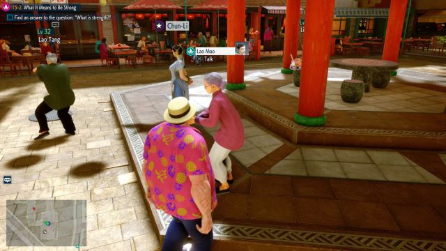 Une capture d’écran de Street Fighter 6 World Tour de la joueuse debout juste à côté de Lao Mao, dont le nom est au-dessus de sa tête. L’emplacement de la carte est affiché dans le coin inférieur gauche de l’écran.